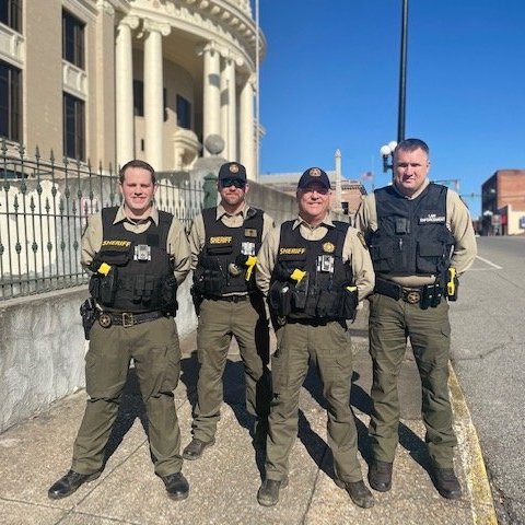 union county sheriff's - sheriffs in front of building
